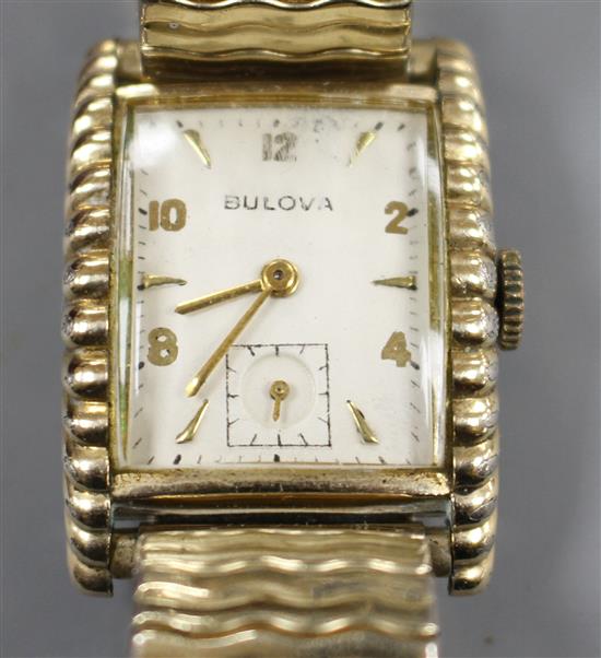 A gentlemans 1950s 10k gold filled Bulova Westover clam shell cased manual wind wrist watch.